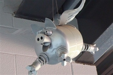 Flying Pigs - Flying above the heads of game goers at QuikTrip Park, our sassy flying pigs feature mom, pop and baby fashioned from recycled airplane parts by Utah artist Fred Conlon.