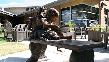 Betty Warmack Library - Sculpted by Colorado artist Gary Alsum, the “Picture Books” bronze sculpture at the Betty Warmack Branch Library celebrates the wonder of reading. The award-winning artist explains that “Children are my favorite subjects because they approach life with wonder and delight.”