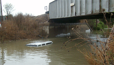 Flooding Under Tarrant Bridge. Each year on average more than 50% of all flood fatalities are vehicle related.