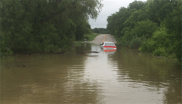 Flooding at Seeton Road in 2010. It only takes 12 inches of water to carry off a small car and 18 inches of water to sweep a larger vehicle away. Don't risk driving into flood waters. Turn Around Don't Drown!