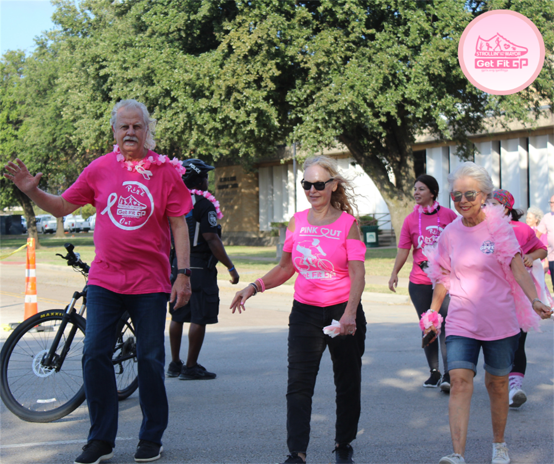 Mayor Ron Jensen, his wife, and Councilwoman Jorja Clemson walking the Pink Out Walk