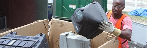Man recycling electronic items