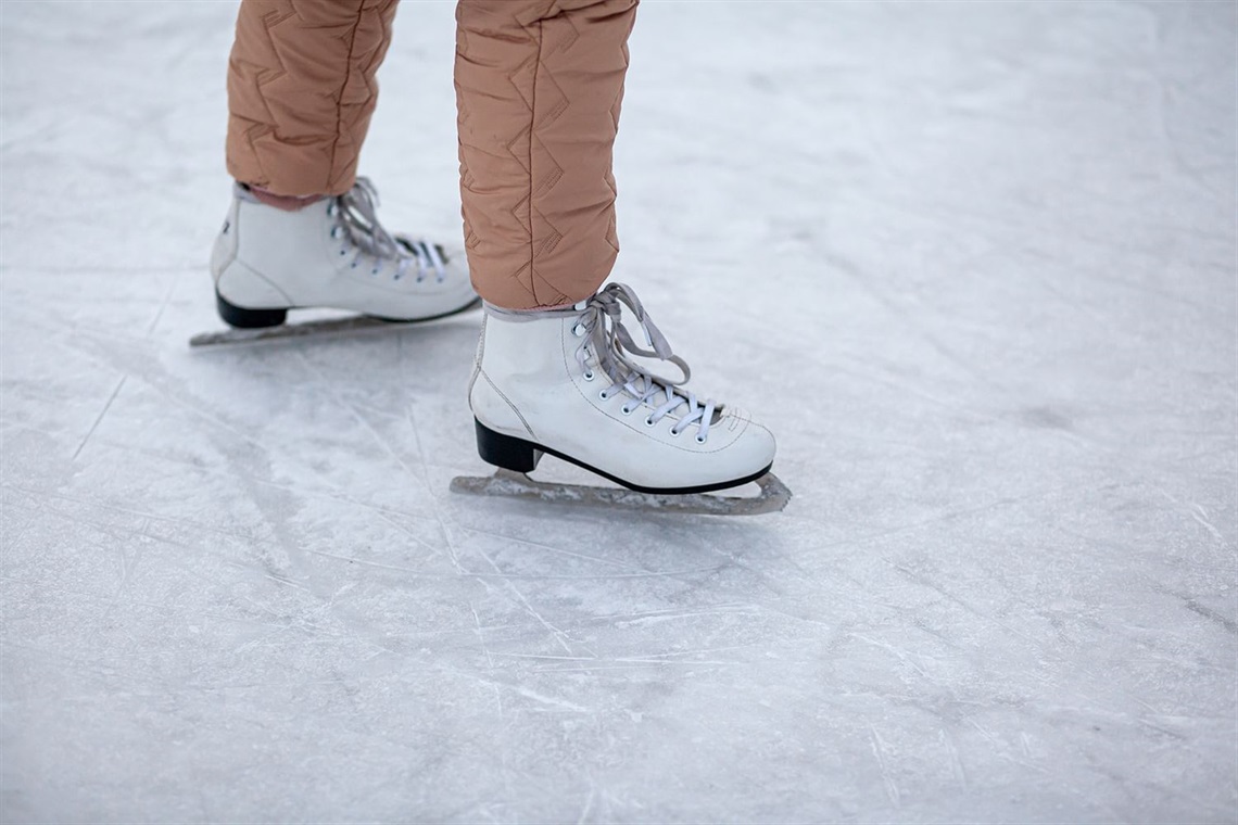 Person wearing ice skates standing on ice