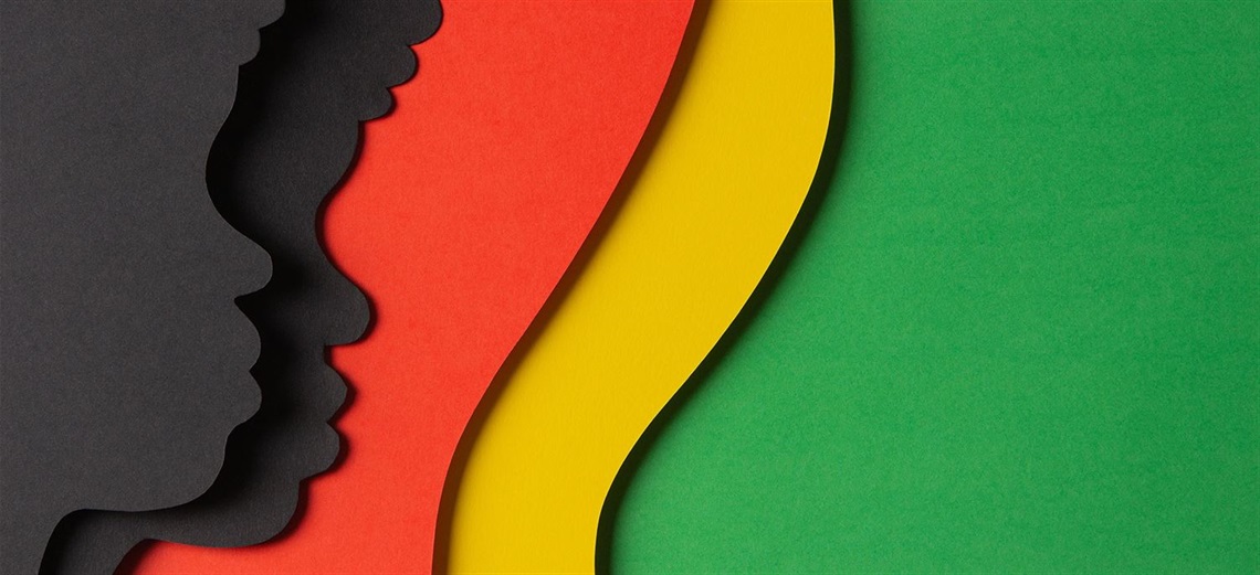 Two silhouettes of Black children against a red, yellow, and green background