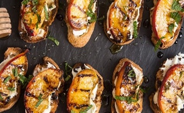 Grilled WeMe Pioneer Bread with Honey Balsamic Marinated Peaches
