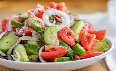Red leaf lettuce salad with cucumbers, tomatoes