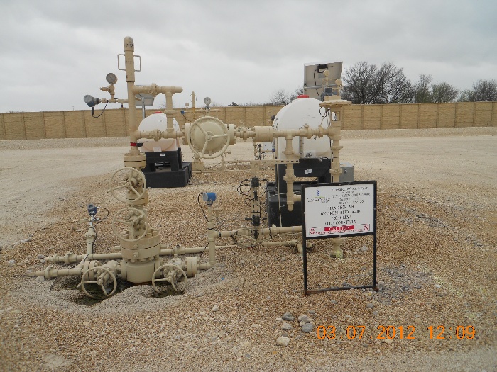 A wellhead or Christmas tree is placed on top of the existing well site to control and regulate the flow of gas