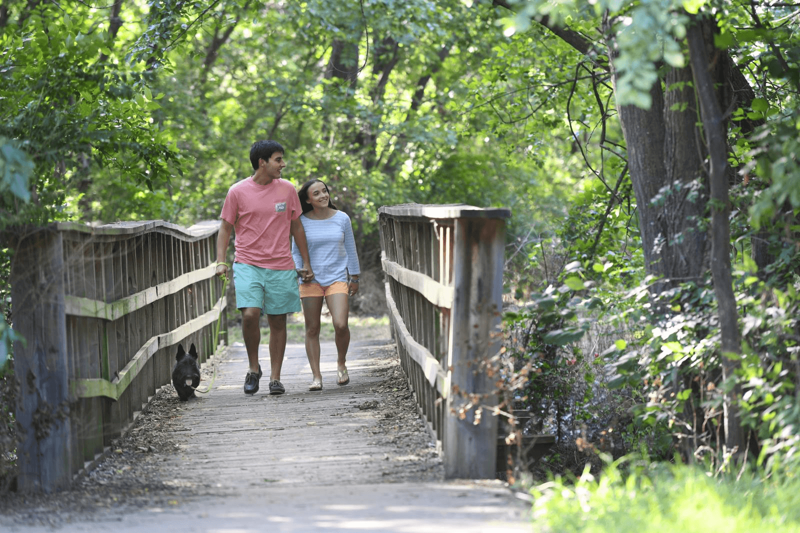 Couple Walking on Bridge