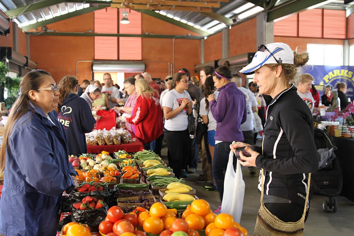 Farmers Market shopper buying produce
