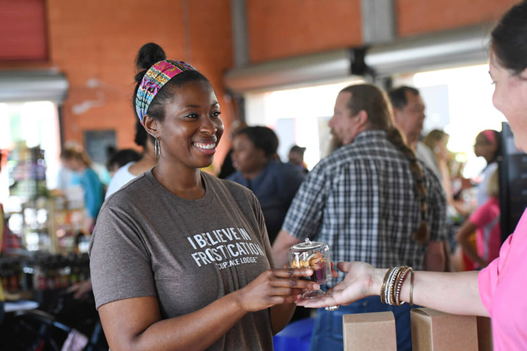 Vendors and customers at Farmers Market